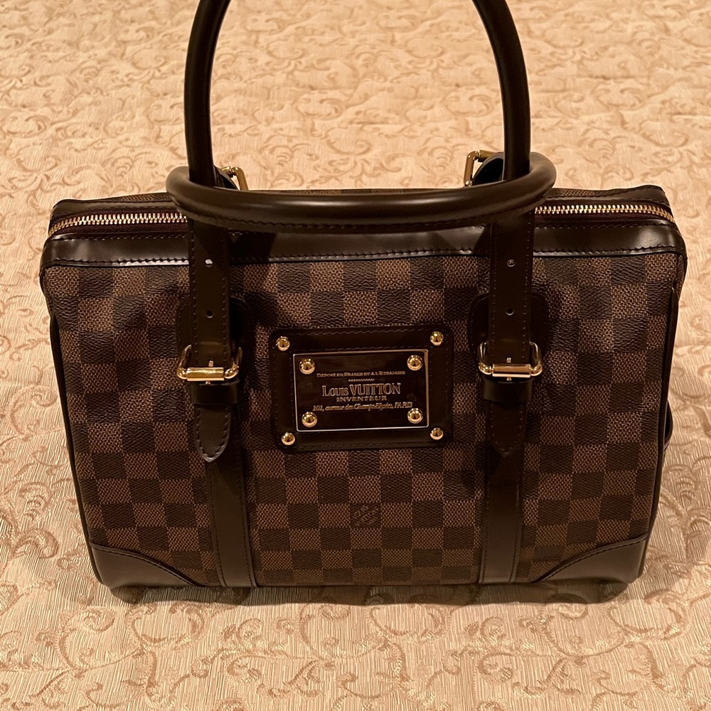 Authentic Louis Vuitton Dark Brown Monogram Stylish Handbag with gold hardware.
